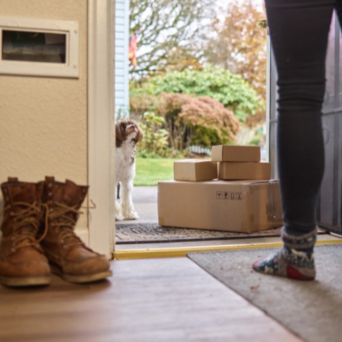 Boxes delivered at a front door.